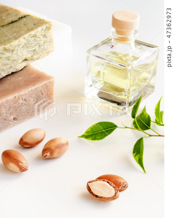 Bottle with valuable oil argan nuts. Cosmetic means. Food product. Jar with argan oil on the Bottle with valuable oil argan nuts. Cosmetic means. Food product. Jar with argan oil on the 47362973