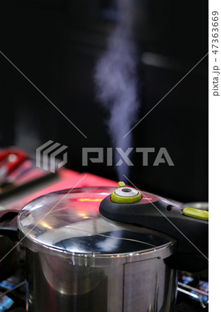 Pressure cooker steam over cooking in a Kitchen 47363669
