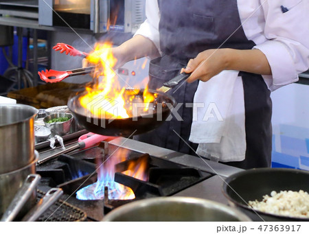 Chef cooking food in the kitchen, preparing food Chef cooking food in the kitchen, preparing food 47363917