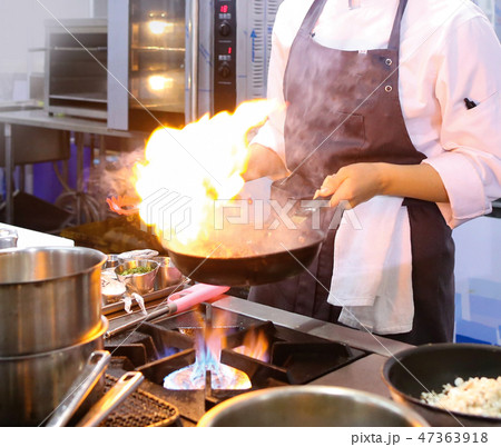 Chef cooking food in the kitchen, preparing food Chef cooking food in the kitchen, preparing food 47363918