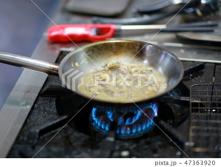 Chef cooking food in the kitchen, preparing food 47363920