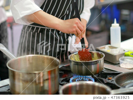 Chef cooking food in the kitchen, preparing food 47363925