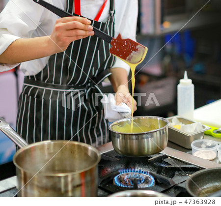 Chef cooking food in the kitchen, preparing food 47363928
