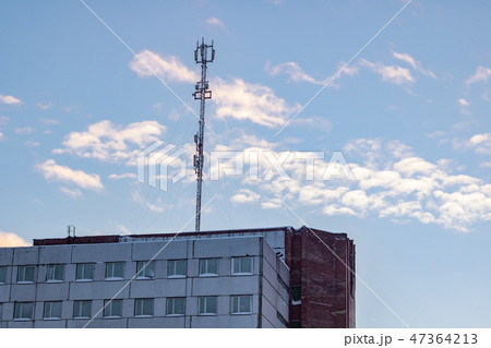 Communication antenna on the roof of a multistory building 47364213