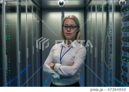 Serious engineer in corridor of data center Serious engineer in corridor of data center 47364930