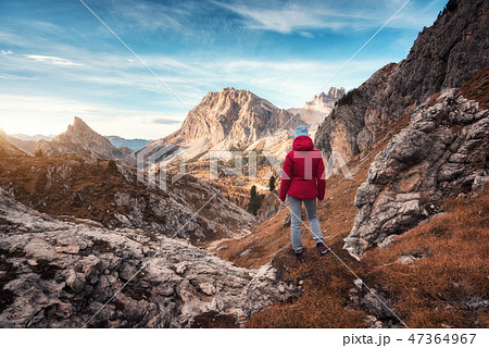 Young woman on the trail looking on mountains Young woman on the trail looking on mountains 47364967