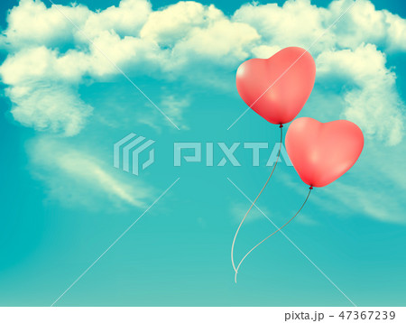 Valentine heart-shaped baloons in a blue sky 47367239