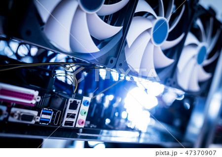 Cryptocurrency mining machine in a close-up shot. Cryptocurrency mining machine in a close-up shot. 47370907