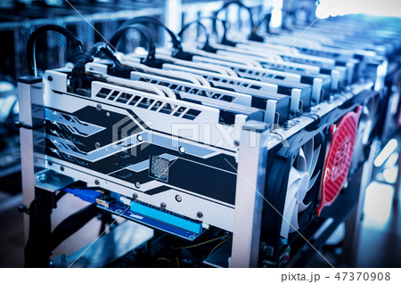 Bitcoin mining devices standing in a row. Bitcoin mining devices standing in a row. 47370908