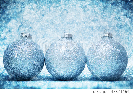 Christmas glass balls on cold frosty glitter background Christmas glass balls on cold frosty glitter background 47371166