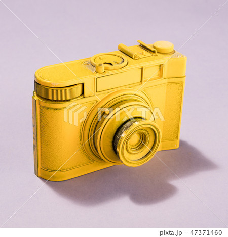 Yellow camera on pastel background. Yellow camera on pastel background. 47371460