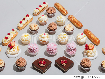 Sweet desserts in triangular composition. 47372226