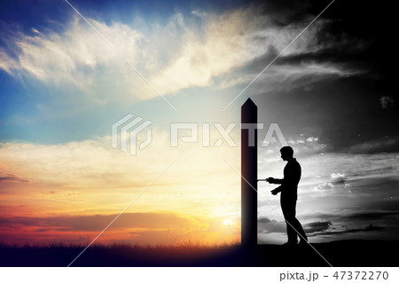 Man trying to open door to new better world. Conceptual change, two worlds 47372270