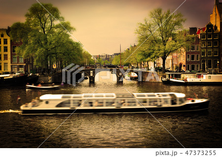 Amsterdam. Romantic bridge over canal. 47373255