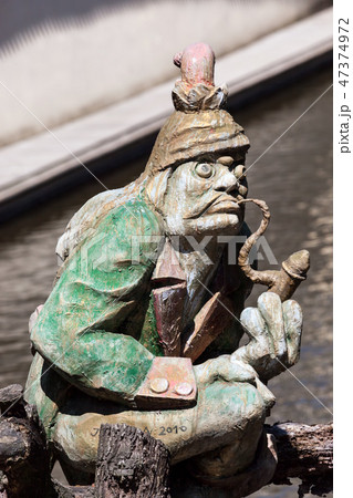 The water goblin statue guarding Velkoprerovsky Mill on Certovka or Devil&#39;s stream. Prague, Czech Republic 47374972