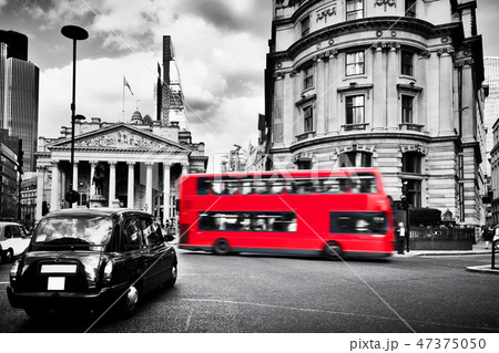 Bank of England, the Royal Exchange in London, the UK. Black taxi cab and red bus. 47375050