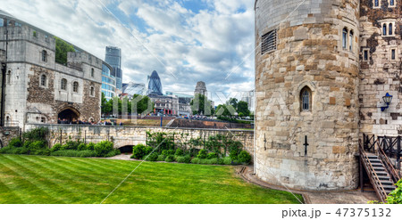 The Tower of London and the city district with Gherkin skyscraper, the UK. 47375132