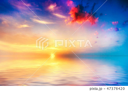 Calm sea at sunset. Beautiful sky with clouds 47376420