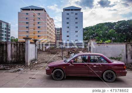 Old car and wrecked urban area 47378602