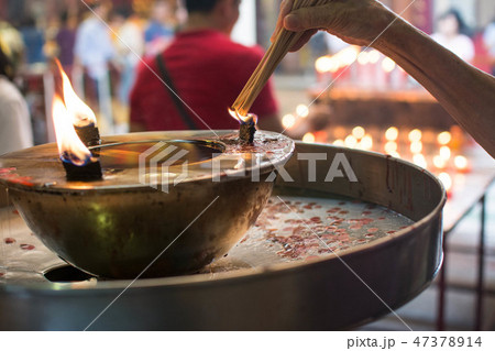 hand cense joss stick to at an incense burne hand cense joss stick to at an incense burne 47378914