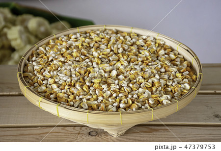 Seed corn in bamboo baskets on wooden table. Seed corn in bamboo baskets on wooden table. 47379753