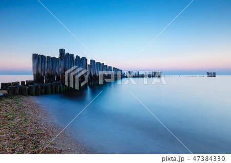 Beautiful and tranquil sunset over the sea Beautiful and tranquil sunset over the sea 47384330