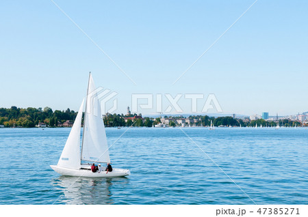White sailing boats in lake Zurich, Switzerland White sailing boats in lake Zurich, Switzerland 47385271