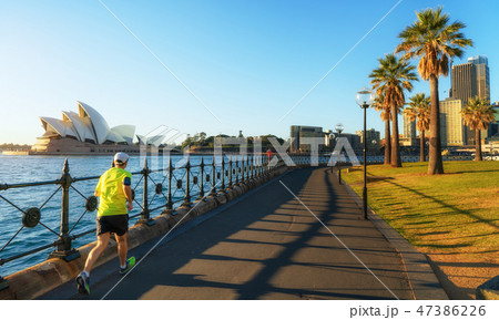 A man running in harbour park 47386226