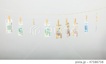 Banknotes on laundry line Banknotes on laundry line 47386738