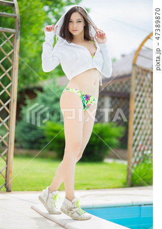 Cute woman posing standing. Cute woman posing standing. 47389870