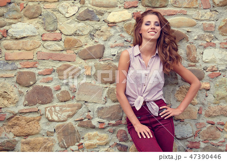 Beautiful woman on the terrace of an Italian country house Beautiful woman on the terrace of an Italian country house 47390446