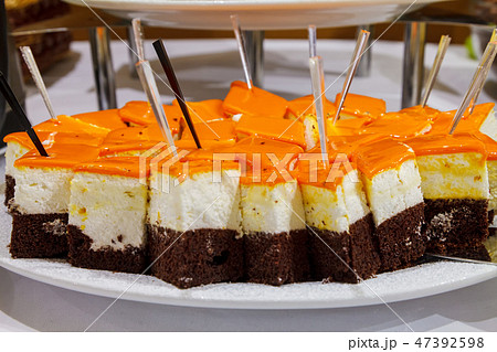 Biscuit chocolate cake with curd cream and bright icing Biscuit chocolate cake with curd cream and bright icing 47392598