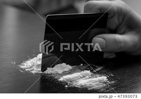 Cocaine powder on the table 47393073