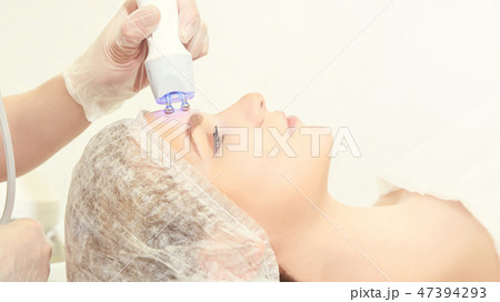 Facial micro current cosmetology procedure 47394293