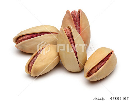 Pistachio nuts on white background Pistachio nuts on white background 47395467