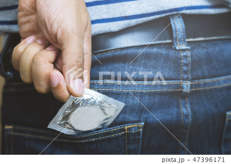 Condom man ready to use in Jeans pocket 47396171