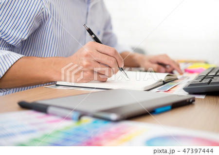designer Editor at work drawing sketches a new project on graphi 47397444