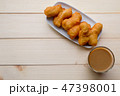 Deep-fried dough stick  with a glass of coffee 47398001