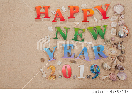 colorful letters happy new year 2019 on the beach 47398118