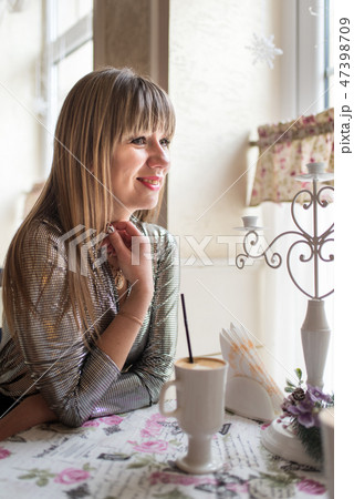 Beautiful young women in cozy cafe 47398709