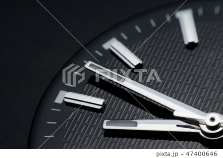 Close up clockwise on black clock face background. 47400646