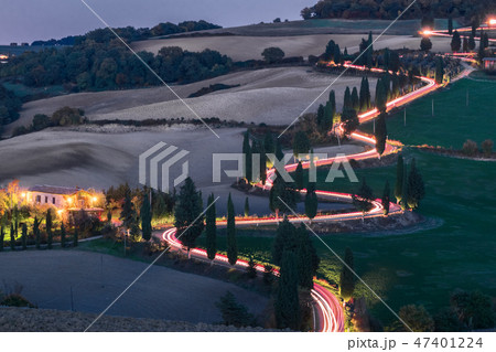 Evening landscapes with car headlights 47401224