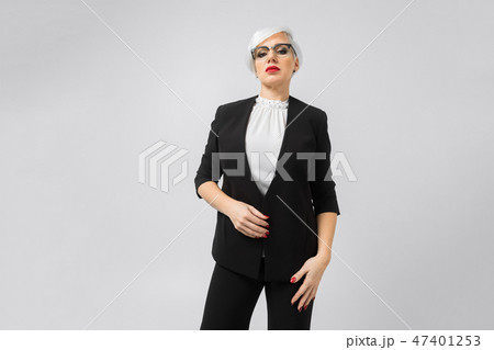 Portrait of a confident business lady in a strict suit isolated on a light background 47401253