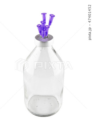 Medical phial with syringe needles stuck into caps Medical phial with syringe needles stuck into caps 47401452
