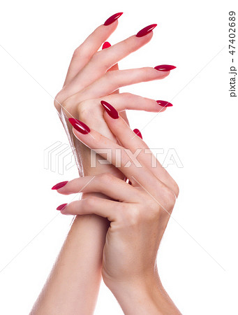 Bright festive red manicure on female hands. Nails design Bright festive red manicure on female hands. Nails design 47402689