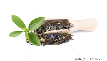 Green Ceylon tea with cornflower and candied fruit, isolated on white background. Green Ceylon tea with cornflower and candied fruit, isolated on white background. 47402750
