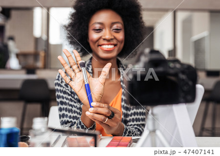 Beautiful african american woman with bright lipstick feeling gorgeous Beautiful african american woman with bright lipstick feeling gorgeous 47407141
