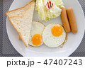 American breakfast dish with eggs, sausage, bread  47407243