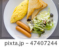 American breakfast dish with eggs, sausage, bread  47407244