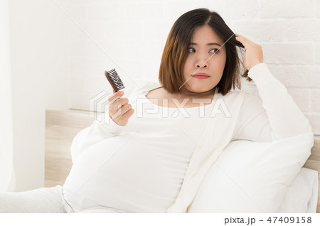 Asian pregnant woman can not making new hair Asian pregnant woman can not making new hair 47409158
